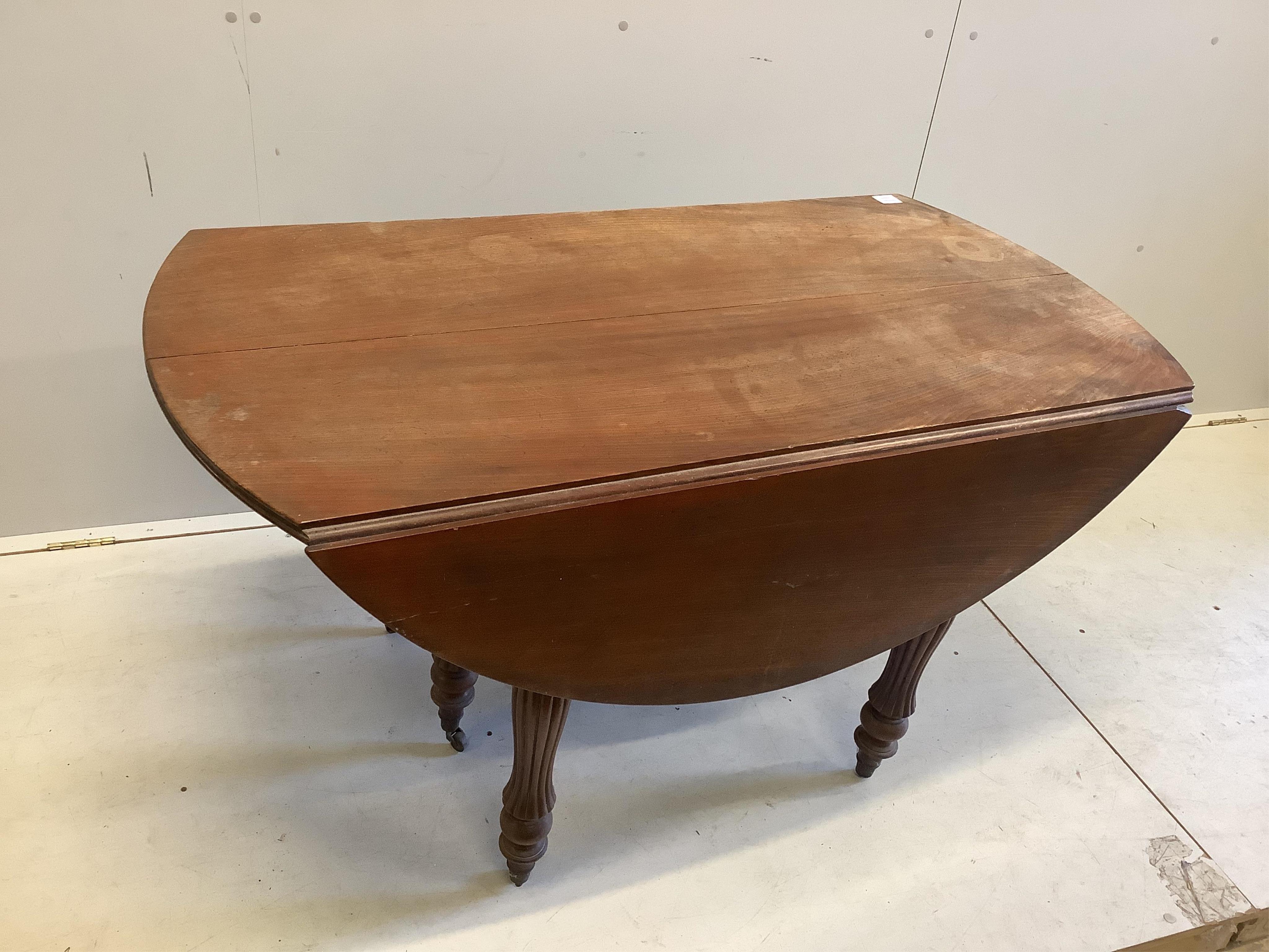 A 19th century Continental mahogany drop leaf extending dining table, no leaves, width 166cm extended, depth 129cm, height 68cm